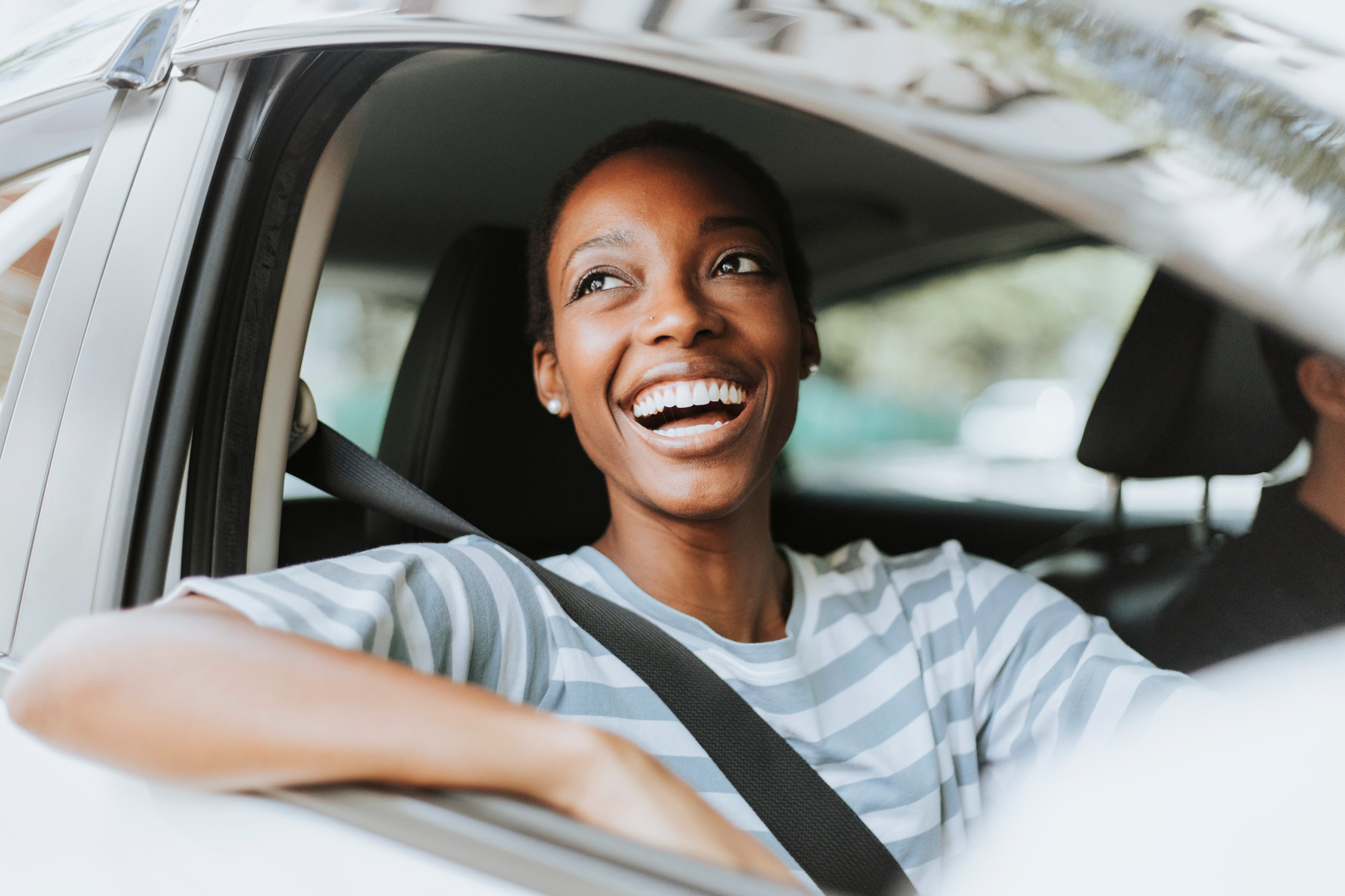 happy-woman-driving-car